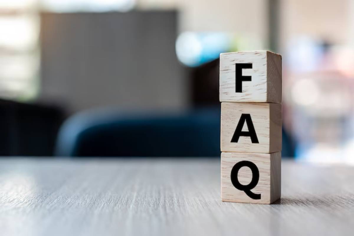 Three wooden blocks stacked vertically, displaying the letters F, A, and Q, representing Frequently Asked Questions.